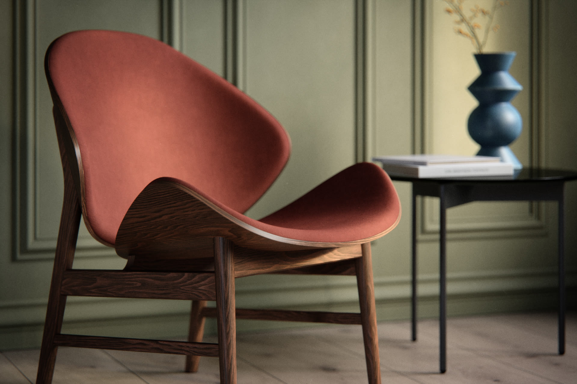 Mid-century modern reddish lounge chair with dark wood frame in front of a green paneled wall, architectural visualization